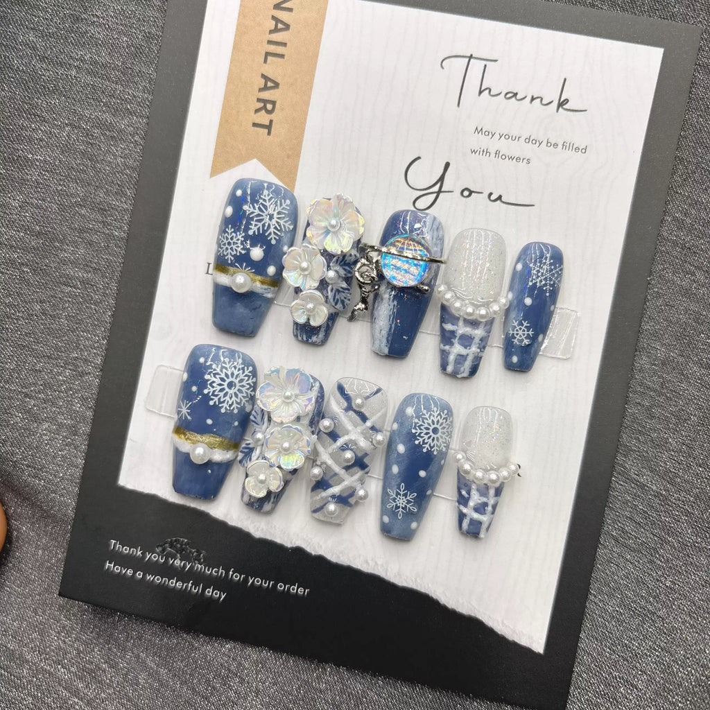 Blue snowflake romantic winter handmade French manicure, a popular trend among online influencers, exuding sophistication and flattering the skin tone, long style, 2026.
